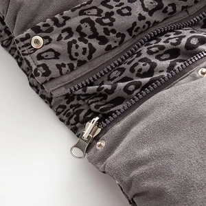 Close-up of leopard print puffer vest with premium metal zipper and snap buttons
