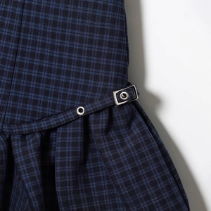 Chic blue plaid mini dress featuring decorative silver eyelet belt buckles and twill texture