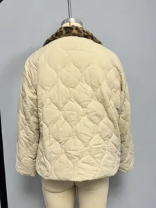 Detail of beige quilted jacket featuring leopard print faux fur collar and onion stitching