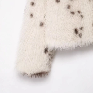 Faux fur animal print jacket with white base and dark brown spots luxury texture