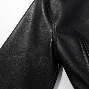 Close-up of premium black pebbled leather texture and high-quality stitching detail