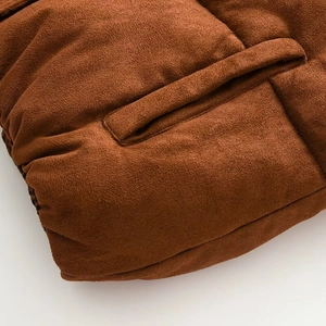 Detail of side pocket on brown suede vest with thick quilted padding and fine stitching