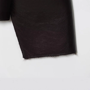 Deep brown faux leather reversible jacket with pebble texture and soft plush lining detail