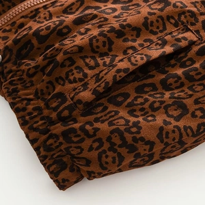 Detail of leopard print vest showing high-quality zipper, side pocket and elastic hem