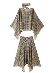 Detailed macro shot of the artistic plaid pattern on the chiffon fabric of the two-piece set