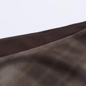 Close-up of deep brown mesh fabric featuring durable double-stitch seams and fine mesh texture