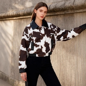 Women's faux fur tie-dye jacket with cow print pattern and black leather collar details