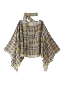 Detail of checkered poncho blouse with choker neck and draped batwing sleeves