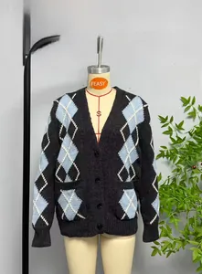 Detail of V-neck cardigan featuring blue and white argyle pattern and black buttons
