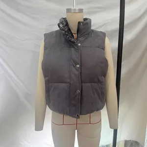 Women's short quilted puffer vest in dark grey featuring a stand collar with leopard print lining