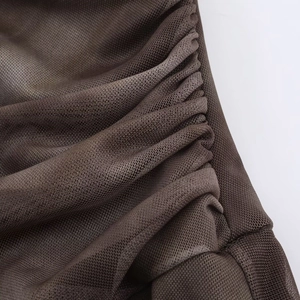 Detailed close-up of dark brown ruched mesh fabric showing delicate honeycomb texture