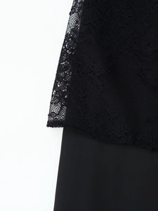 Detailed view of the intricate black lace stitching and smooth satin fabric on the pants