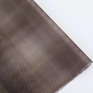 Detailed macro view of the semi-transparent brown fine mesh fabric for women dress