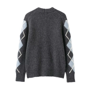 Close-up of the back of a dark grey argyle knit cardigan with blue and white diamond patterns