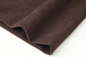 Close-up of premium dark brown wool fabric texture with thick winter coat material