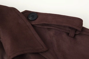 Close-up of brown faux suede coat featuring notched lapels and black resin buttons