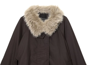 Close-up of a waterproof parka featuring a detachable faux fur collar and Indefeir tag