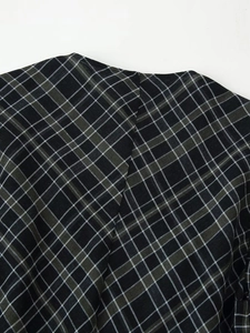 Gros plan sur la texture du tissu à carreaux noir et gris avec motif tissé détaillé