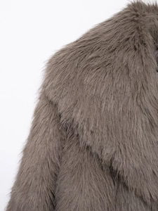 Detailed close-up of soft brown faux fur collar on a stylish short winter coat
