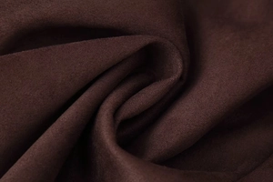 Macro shot of dark brown suede fabric texture on a long double-breasted coat