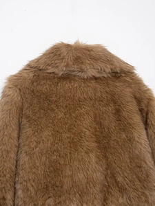 Close-up of the thick faux fur texture and wide collar on this brown gradient winter coat