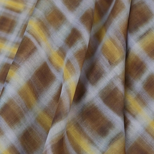 Plaid poncho top in warm brown and mustard yellow with soft woven fabric texture