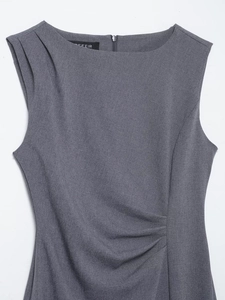 Detailed view of the side pleats and textured fabric on this grey midi dress