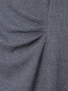 Macro shot of grey woven fabric detailing soft pleats and elegant draped textures