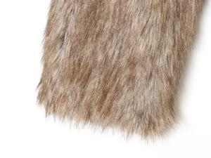 Close-up macro of premium brown faux fur texture with long soft fibers and rich density
