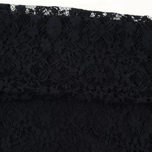 Elegant black lace strapless dress featuring intricate floral mesh and textured details