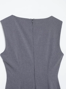 Detail view of the grey midi dress back featuring a hidden zipper and woven texture fabric
