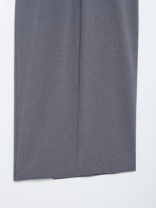 Detail shot of charcoal grey midi dress fabric texture with clean stitched hemline