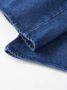 Close-up of vintage denim shirt cuff with reinforced double stitching and twill texture