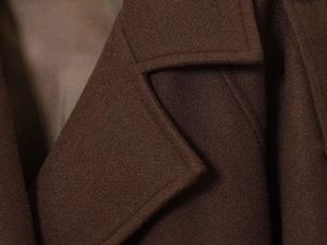 Close-up of the lapel stitching and smooth lining on this dark brown wool blend jacket