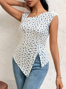 Detail of slim sleeveless floral top with asymmetrical hem and side ruching texture