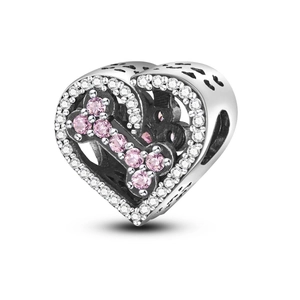 Detail of 925 sterling silver heart charm with pink CZ bone and black paw prints