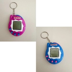 Detail showing egg-shaped virtual pet consoles in purple and blue with metal keychains