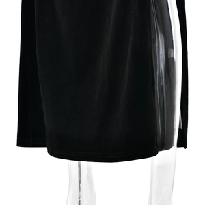 Detail view of the velvet gown hemline with high-quality stitching and smooth texture