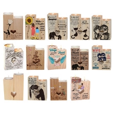 Various engraved wooden heart candle holders with sentimental quotes for home decor