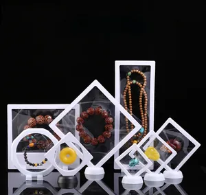 Various sizes of PE film suspension jewelry boxes in black and white with bases