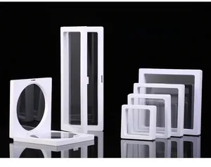 Various sizes of white PE film 3D floating display boxes for jewelry on a black background
