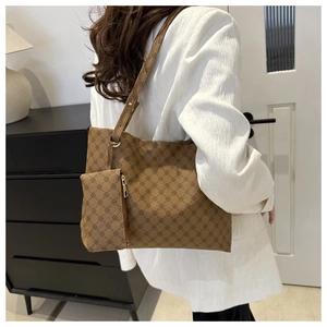 Detail view of large brown vintage pattern tote bag with matching zippered pouch accessory