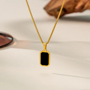 Minimalist gold titanium steel necklace with a rectangular black pendant on a box chain