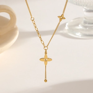 Elegant gold four-leaf clover tassel necklace with asymmetrical chain for women