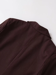 Close-up of linen blend blazer showing back seam detail and twill fabric texture