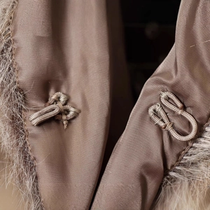Short faux fur jacket for women in dark brown with hook closure and smooth lining detail