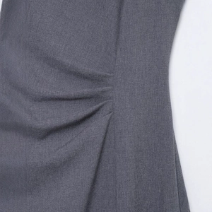 Slim fit dark grey midi dress featuring elegant side gathering and woven texture details