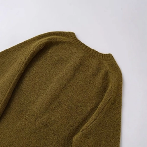 Olive green crew neck knit sweater with raglan sleeves and textured wool finish