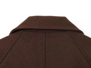 Detail of dark brown wool jacket lapel with neat stitching and minimalist texture