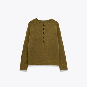Olive green henley knit sweater with five black buttons and ribbed cuffs on white background